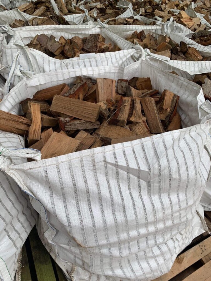 A bulk bag of split softwood logs
