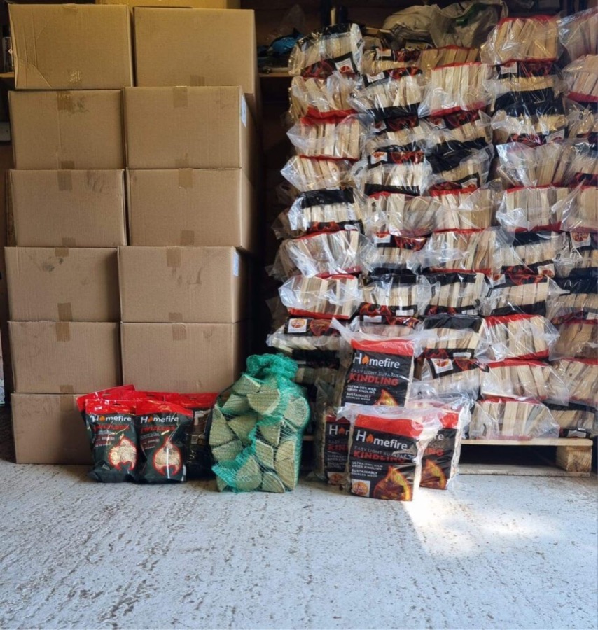Bagged logs and kindling stacked in the store